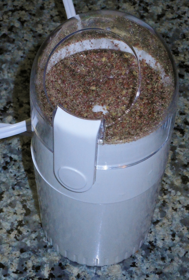 I ground 1/4 cup of flax seed in a coffee grinder.  It measured a little over 1/4 cup after I ground it, but I put the entire amount in the dough.