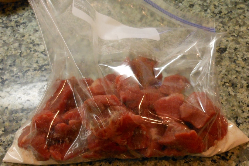 I put a couple tablespoons of flour in a gallon size ziplock bag and put in the stew meat.