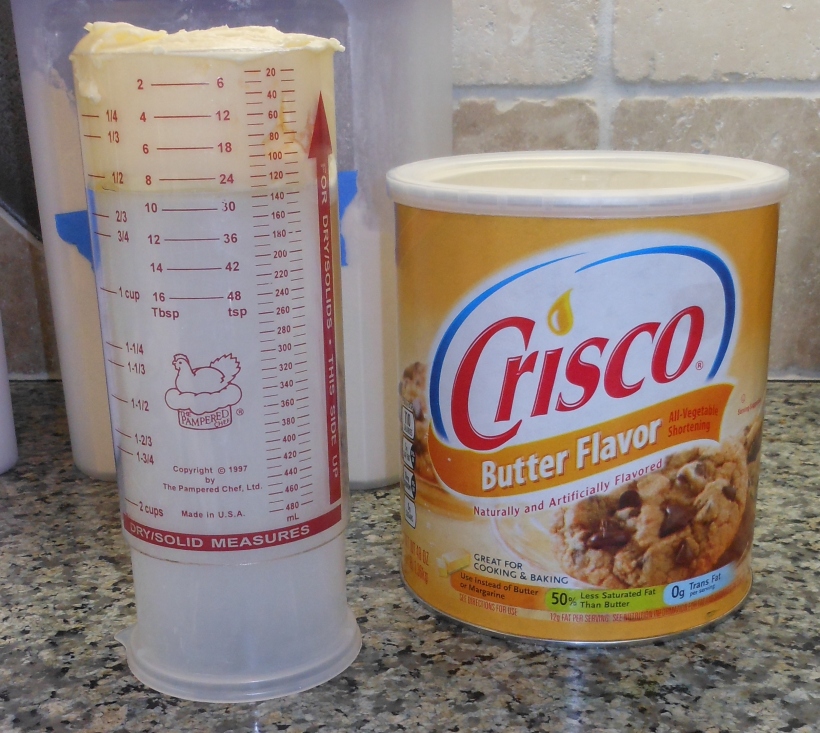 I used to buy sticks of shortening, because I hated measuring it, but I bought a super-cool Pampered Chef measuring cup which has a nifty way to measure shortening, peanut butter, etc.