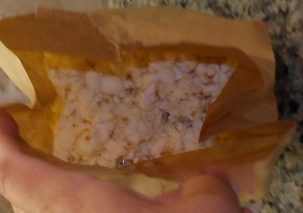 Your popcorn should look something like this when you open the bag. You can either fold down the bag and eat it right out of the bag (after adding anything else you want: salt, butter, etc.)...